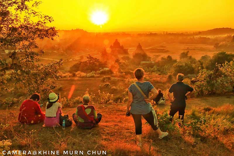Foreign travellers enjoy sunset at the ancient city of Mrauk-U in 2018. (Photo: Khine Murn Chun)